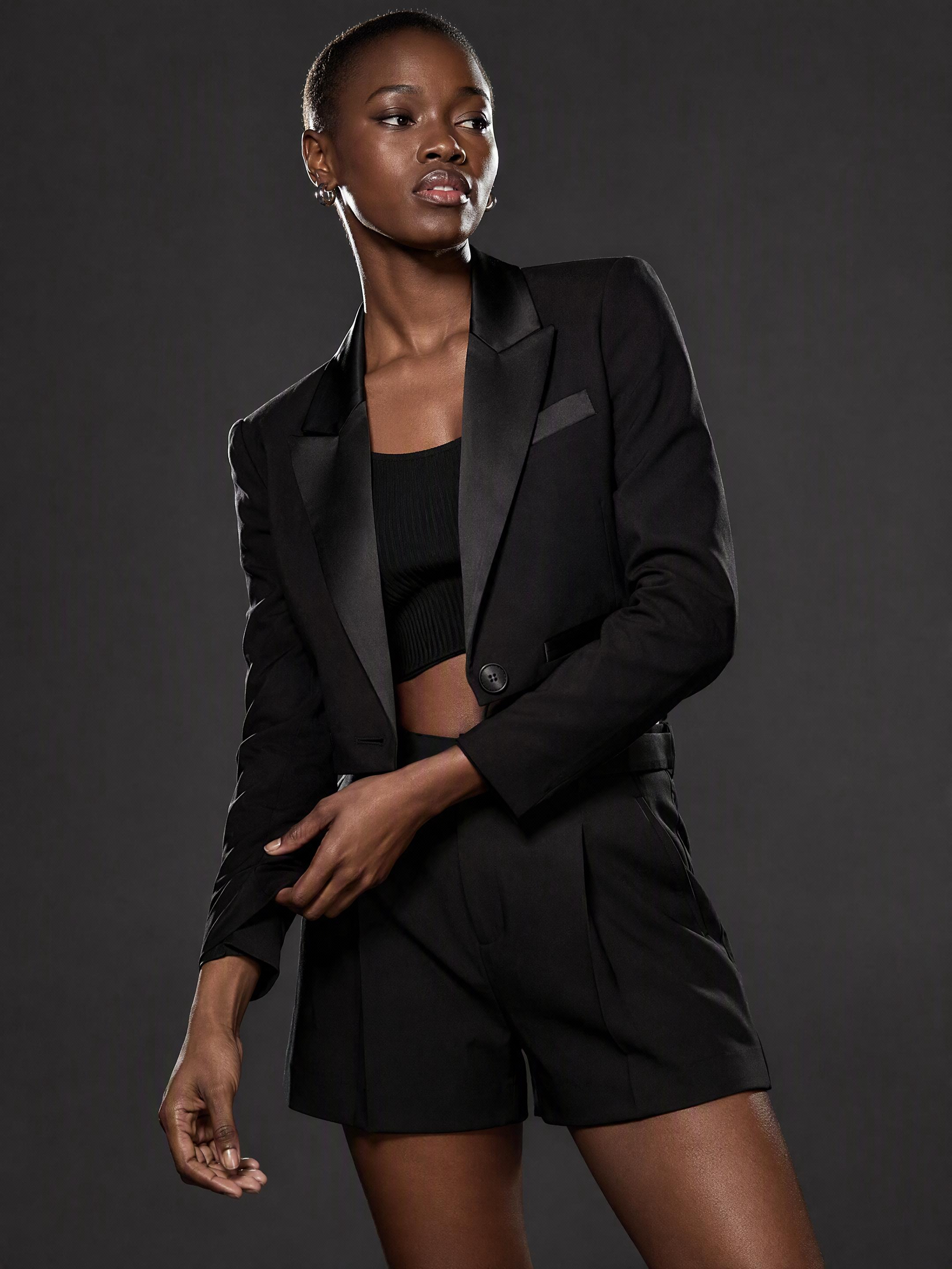 Using reference image 1, generate a 2×2 grid image:Each grid cell features the model from the reference image in a distinct pose with noticeable variation. Ensure all poses are elegant and flattering. Keep the clothing and camera angle unchanged. Note: The 2×2 grid must have no white borders. image1:Model's pose1, image2:Model's pose4, image3:Model's pose8, image4:Model's pose9, original image 1
